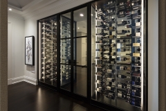 Glass Wine Cellar Separating Two Rooms