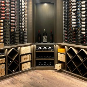 Wine bottles stored in pristine condition on wine cellar walls.