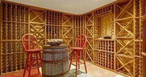 a beautiful wooden wine rack with two chairs
