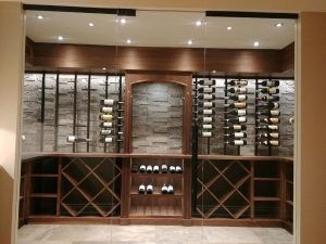 wooden wine racks in glass door wine cellar Toronto