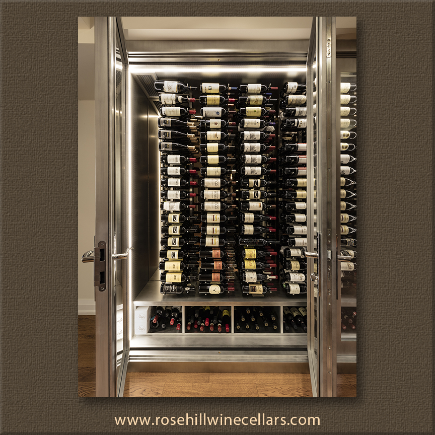 double doors allow wine collector to access dozens on wine bottles