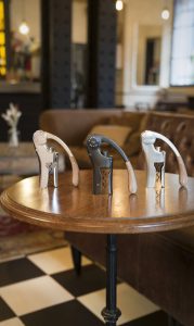 Three wine corkscrews on table display