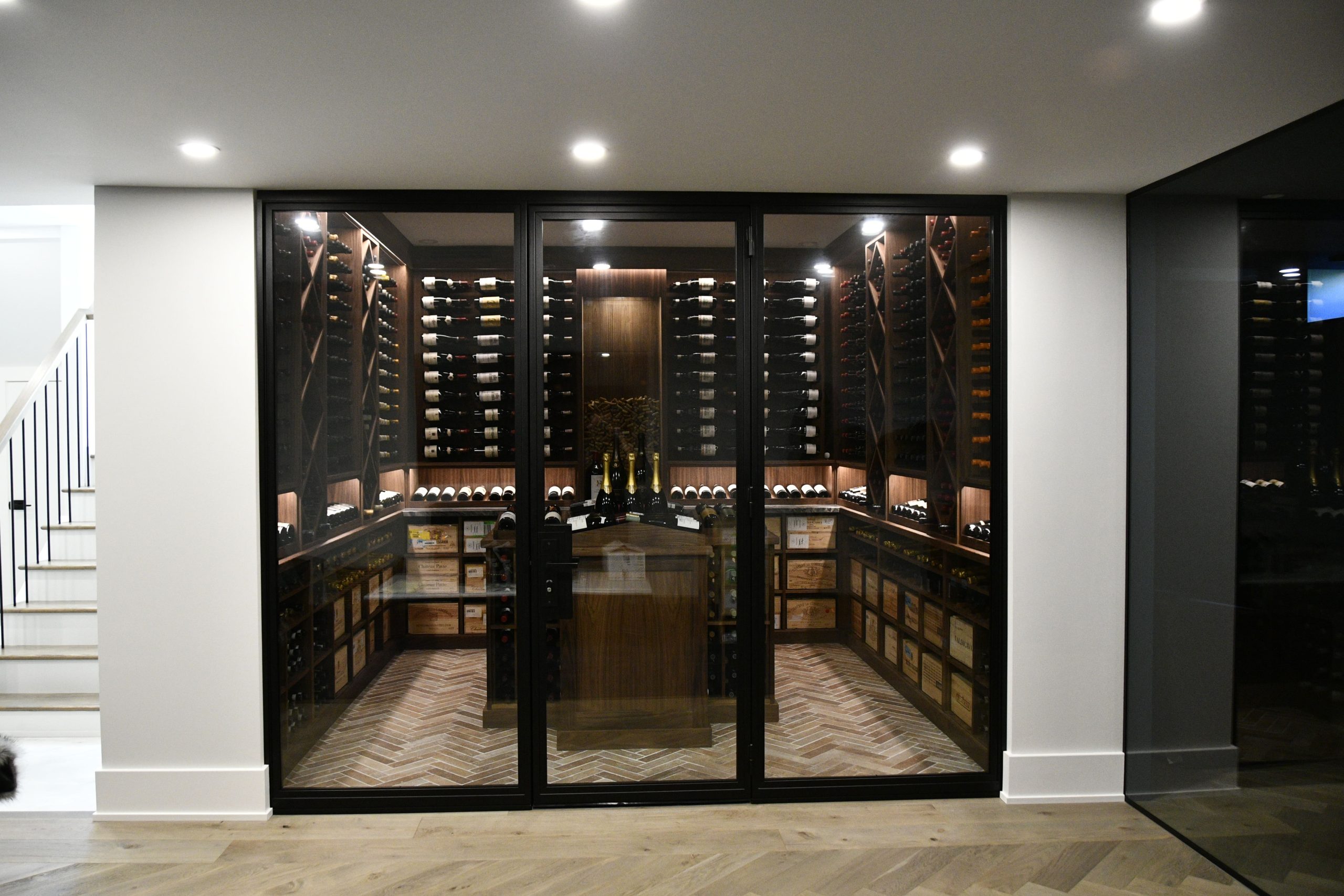 Premium wines preserved in a glass sealed home wine cellar.