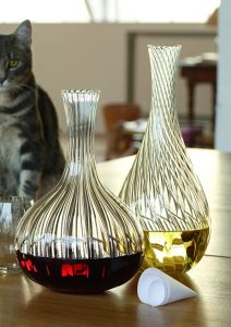 Beautiful glass decanters with red and white wine.