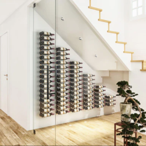 W Series Under the Stairs storing wine bottles in a cascading order under a staircase.